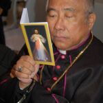 The Most Reverend Ramon C. Arguelles, archbishop of Lipa, Philippines, does a little Divine Mercy reading between talks at the Basilica of St. John Lateran.