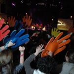 Hands big and small wave to the music at the close-out of Day 4 of the World Apostolic Congress on Mercy.