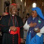 Francis Cardinal Arinze of Nigeria shares a laugh with a congress participant following his talk on Friday morning at St. John Lateran.